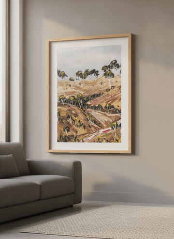 Modern wall art styled above a sofa in a neutral living room