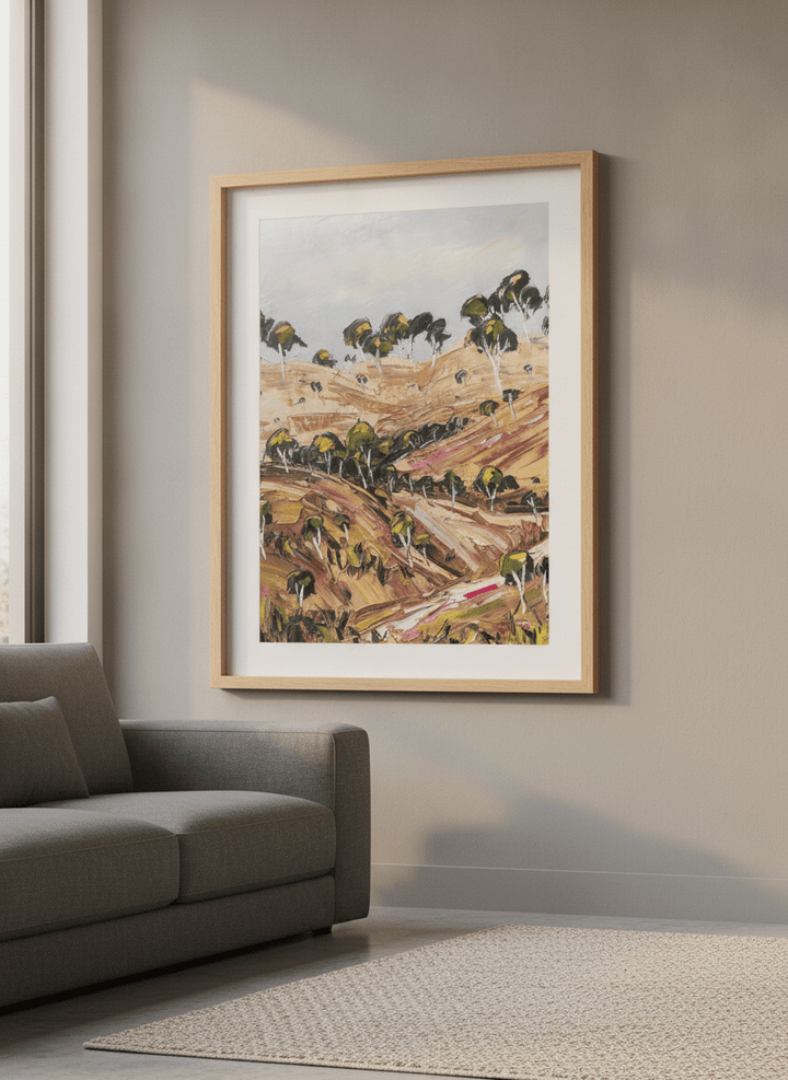 Modern wall art styled above a sofa in a neutral living room