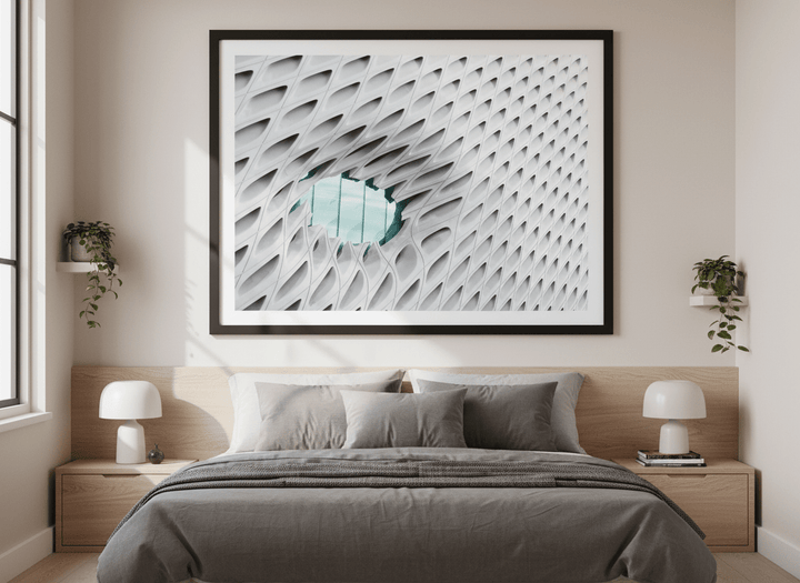 Minimalist artwork displayed in a calm, light-filled bedroom interior