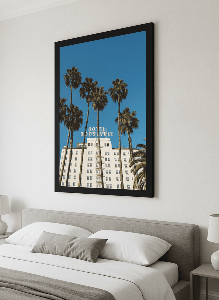 Minimalist artwork displayed in a calm, light-filled bedroom interior