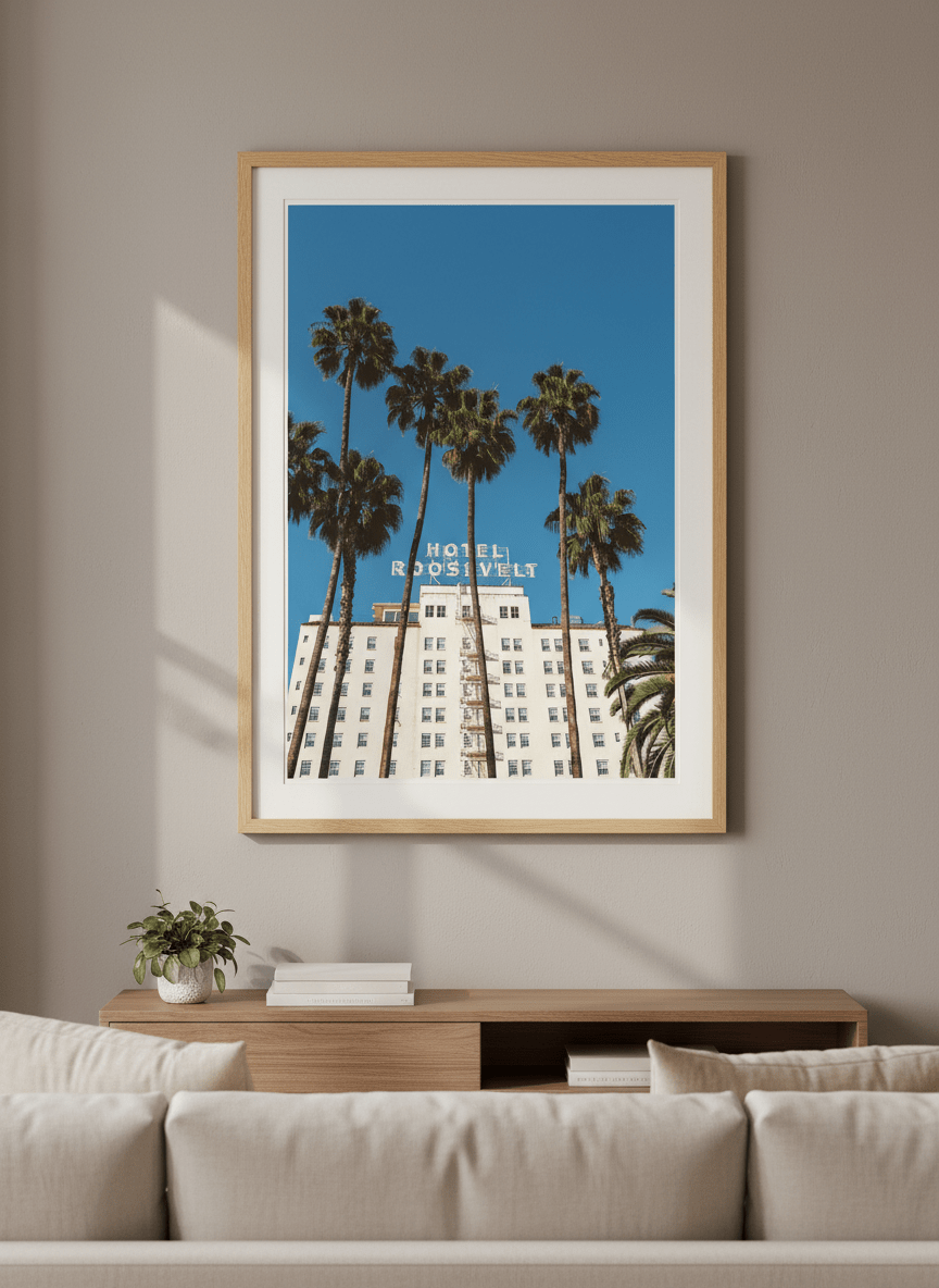 Modern wall art styled above a sofa in a neutral living room