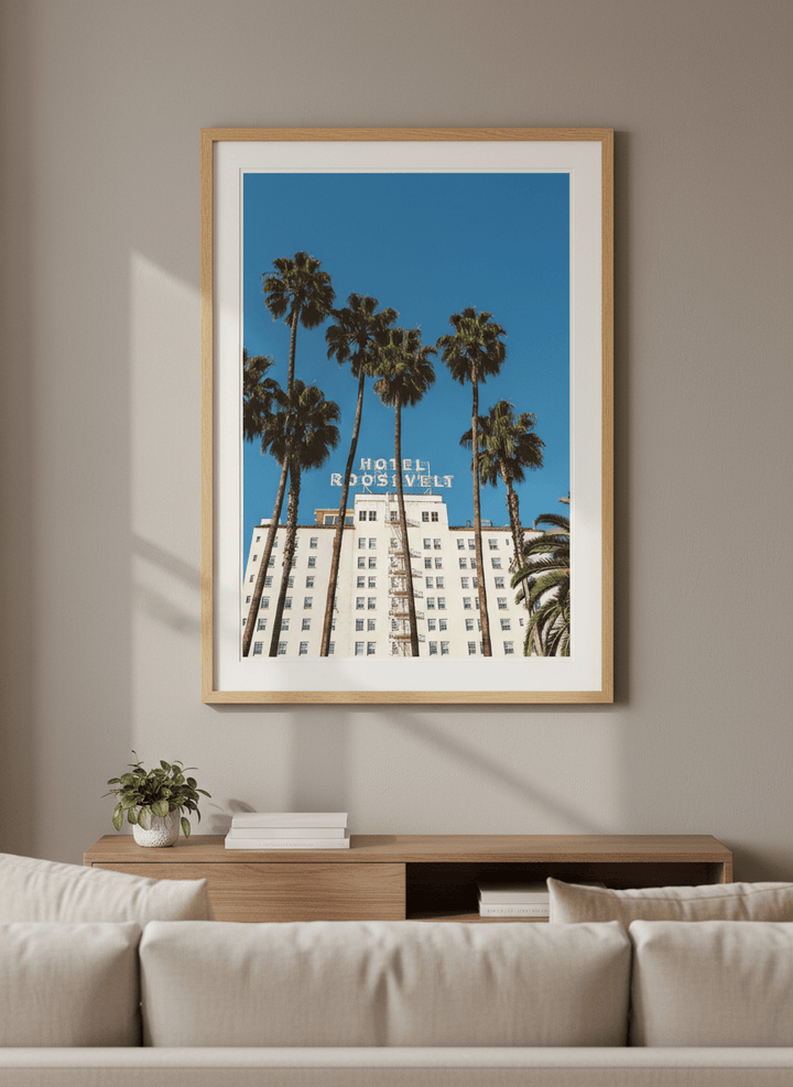 Modern wall art styled above a sofa in a neutral living room