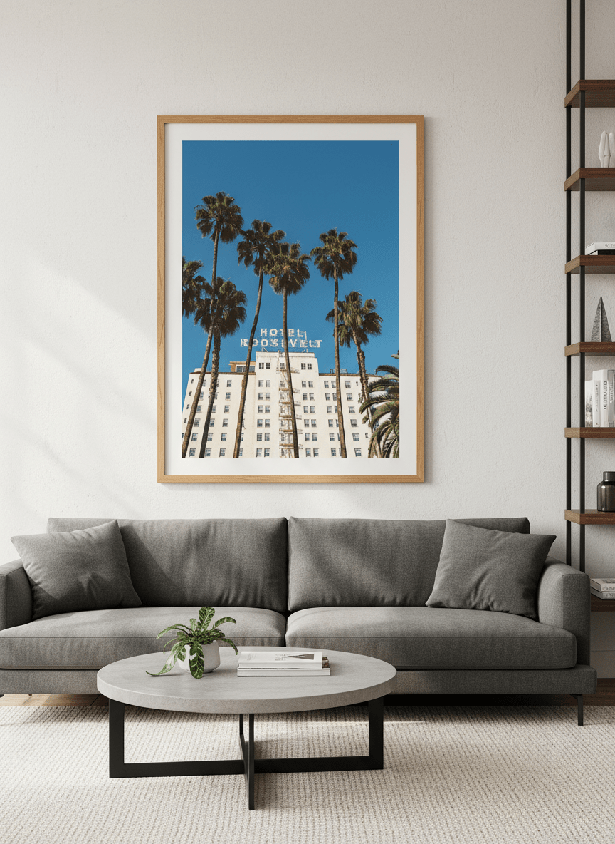 Modern wall art styled above a sofa in a neutral living room