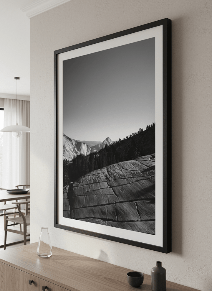 Wall art styled above a dining table in a contemporary home