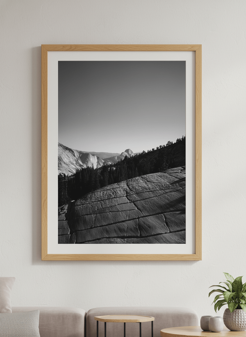 Modern wall art styled above a sofa in a neutral living room