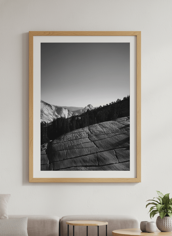 Modern wall art styled above a sofa in a neutral living room