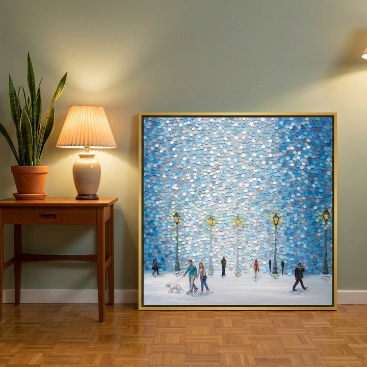 Canvas wall art with a gold leaf surround leaning against the wall in a mid-century dining room