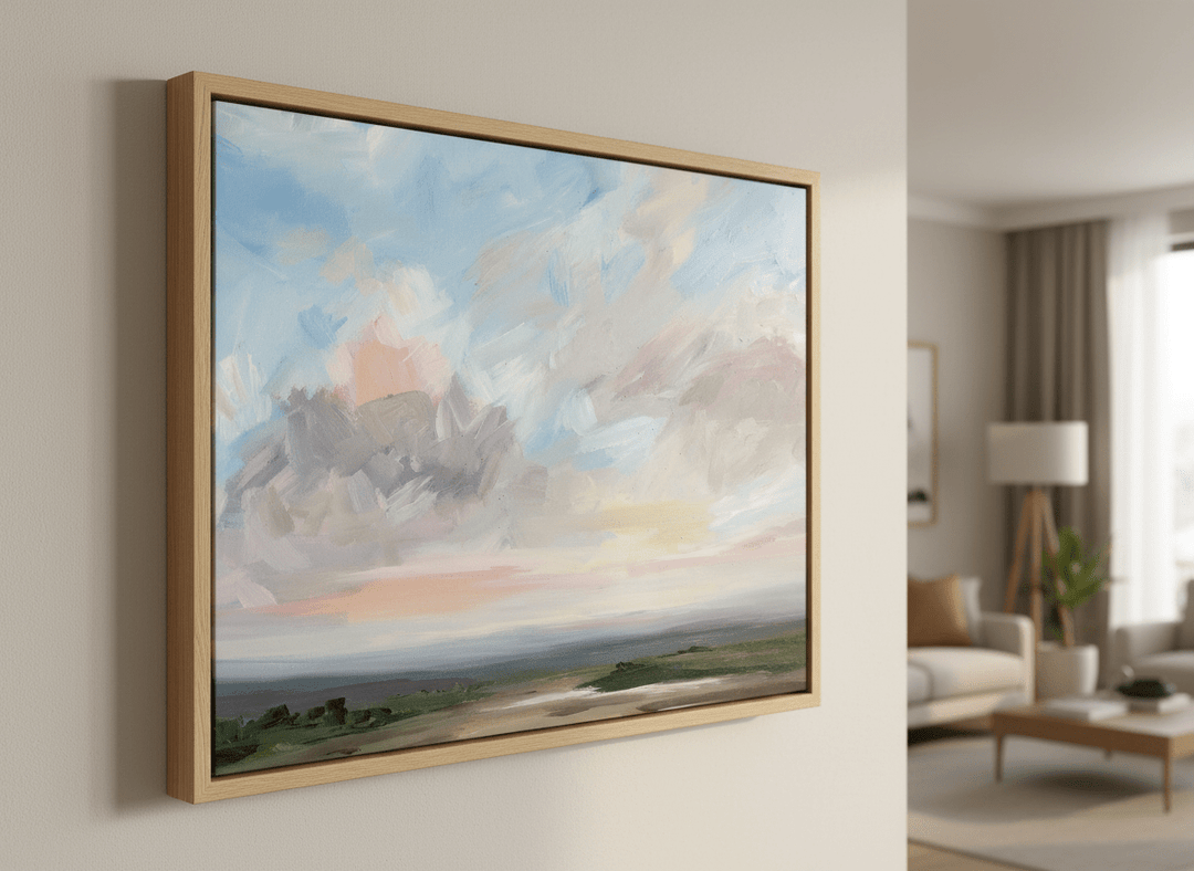Modern wall art styled above a sofa in a neutral living room
