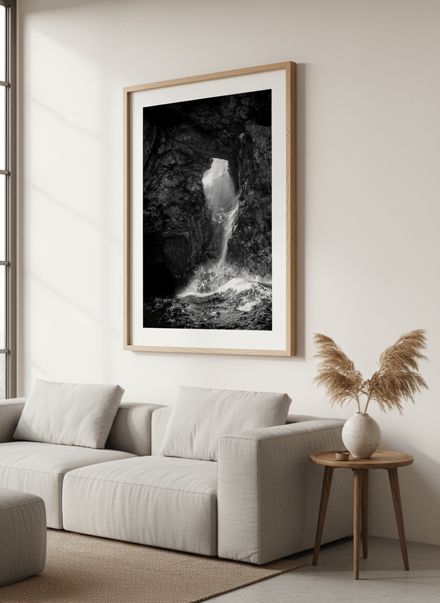 Modern wall art styled above a sofa in a neutral living room