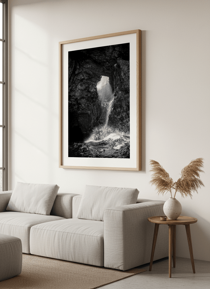 Modern wall art styled above a sofa in a neutral living room