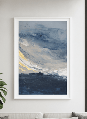 Modern wall art styled above a sofa in a neutral living room