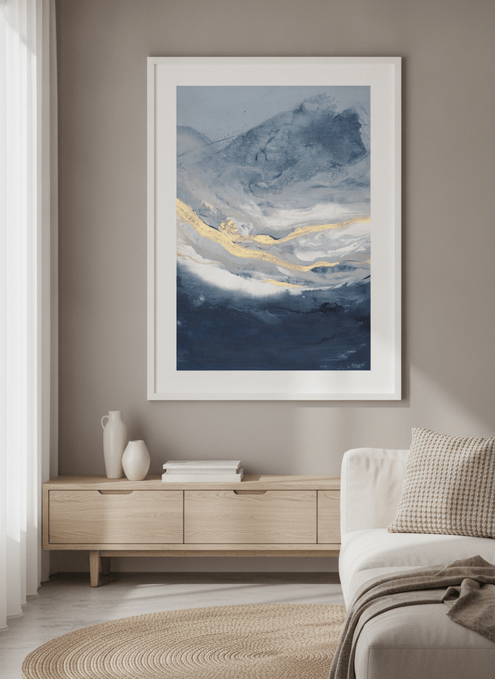 Modern wall art styled above a sofa in a neutral living room