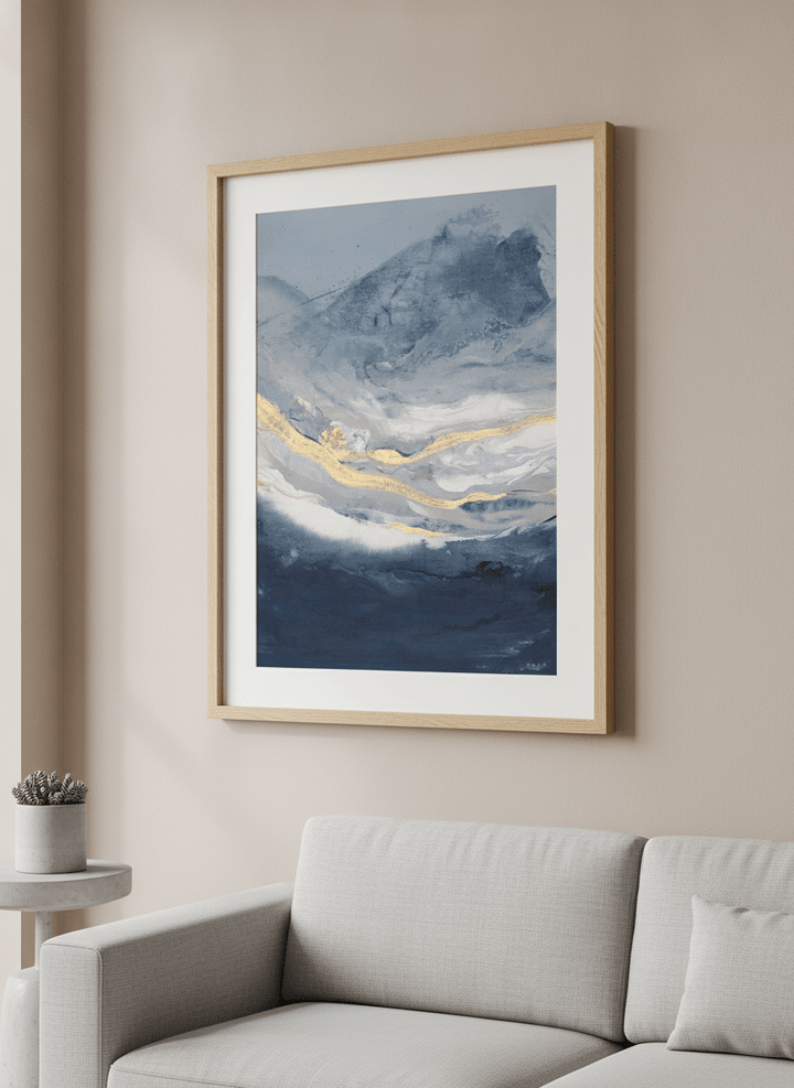 Modern wall art styled above a sofa in a neutral living room