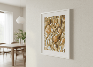Wall art styled above a dining table in a contemporary home