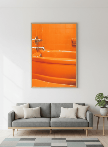 Modern wall art styled above a sofa in a neutral living room