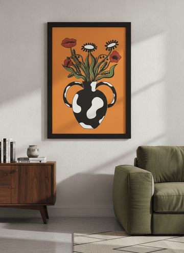 Modern wall art styled above a sofa in a neutral living room