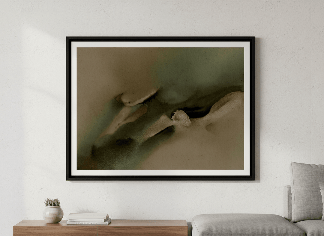 Modern wall art styled above a sofa in a neutral living room