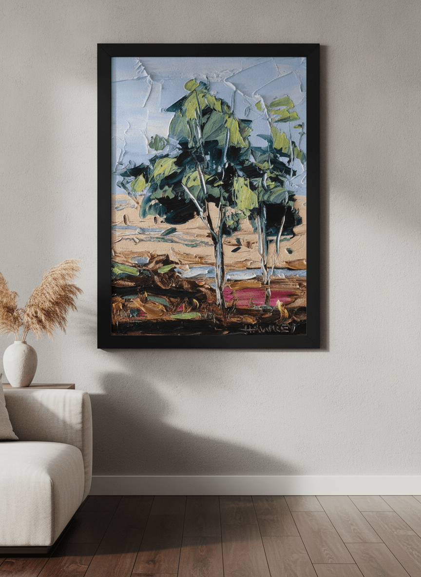 Modern wall art styled above a sofa in a neutral living room