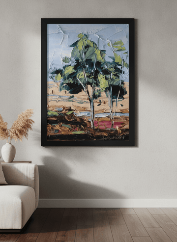 Modern wall art styled above a sofa in a neutral living room