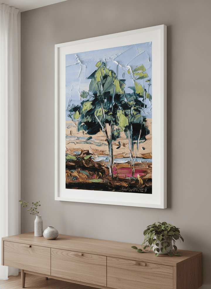 Wall art styled above a dining table in a contemporary home