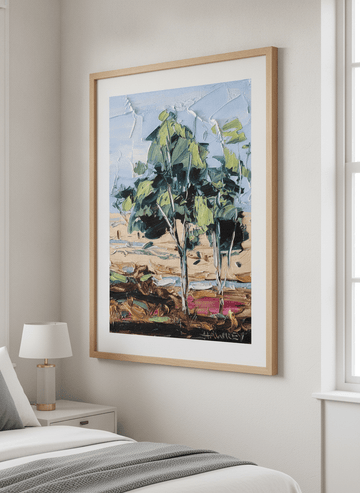 Minimalist artwork displayed in a calm, light-filled bedroom interior