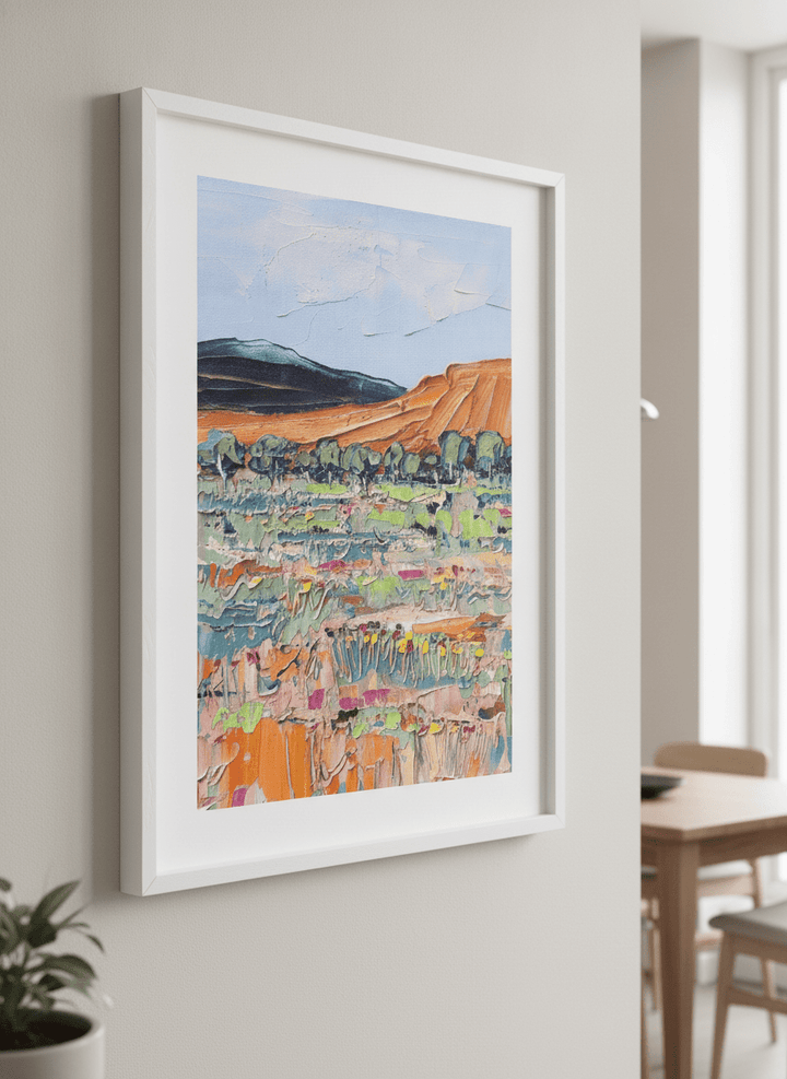 Wall art styled above a dining table in a contemporary home