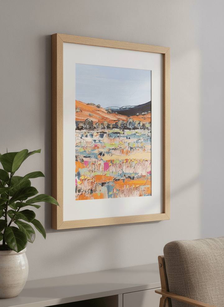 Modern wall art styled above a sofa in a neutral living room