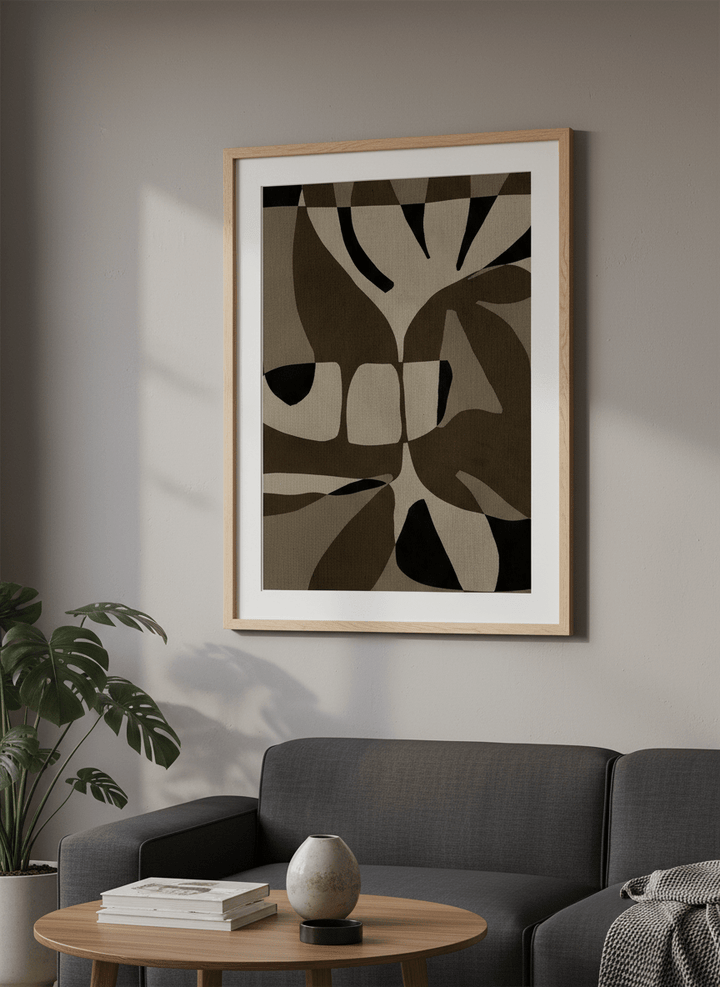 Modern wall art styled above a sofa in a neutral living room