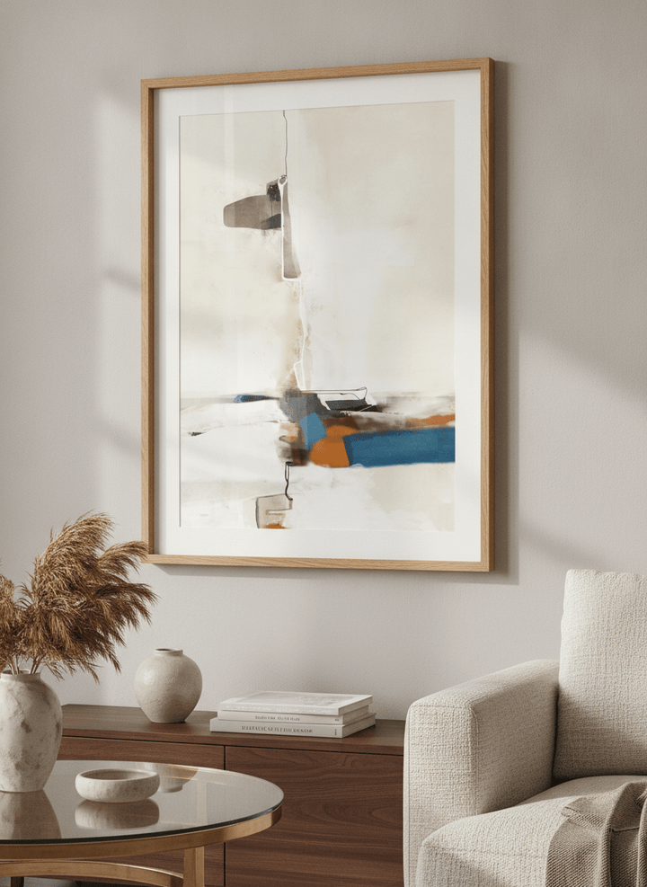 Modern wall art styled above a sofa in a neutral living room