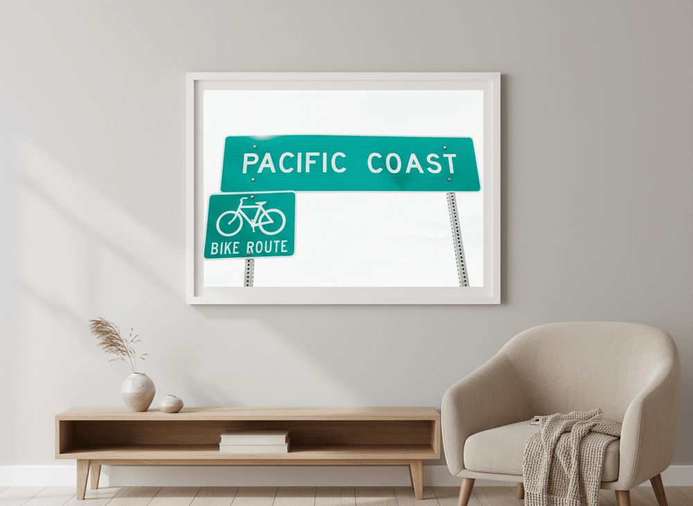 Modern wall art styled above a sofa in a neutral living room