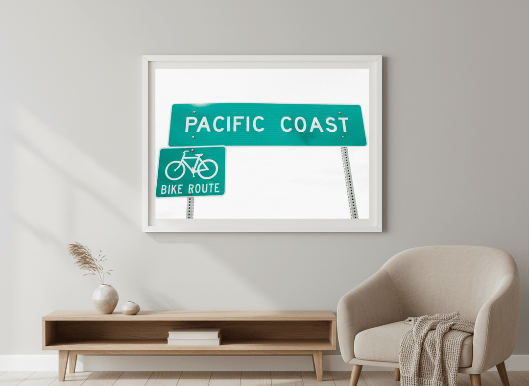Modern wall art styled above a sofa in a neutral living room