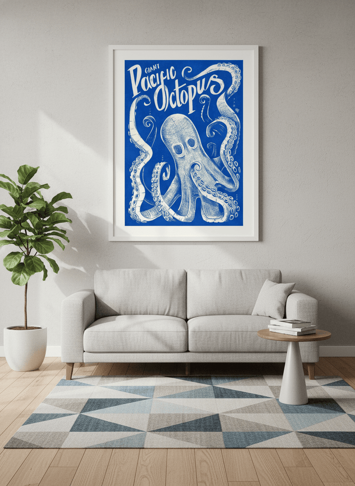 Modern wall art styled above a sofa in a neutral living room