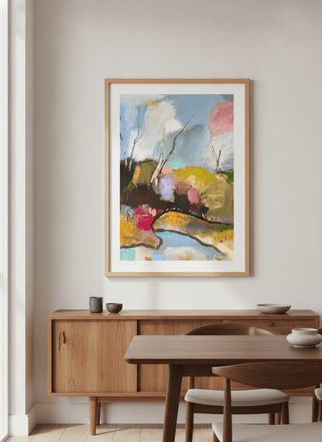 Wall art styled above a dining table in a contemporary home