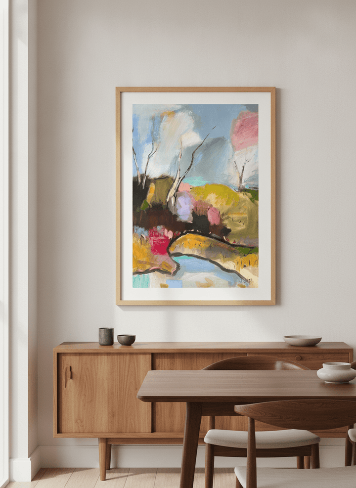 Wall art styled above a dining table in a contemporary home