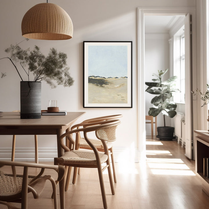 Dining room with wooden table, chairs, and a picture on the wall.