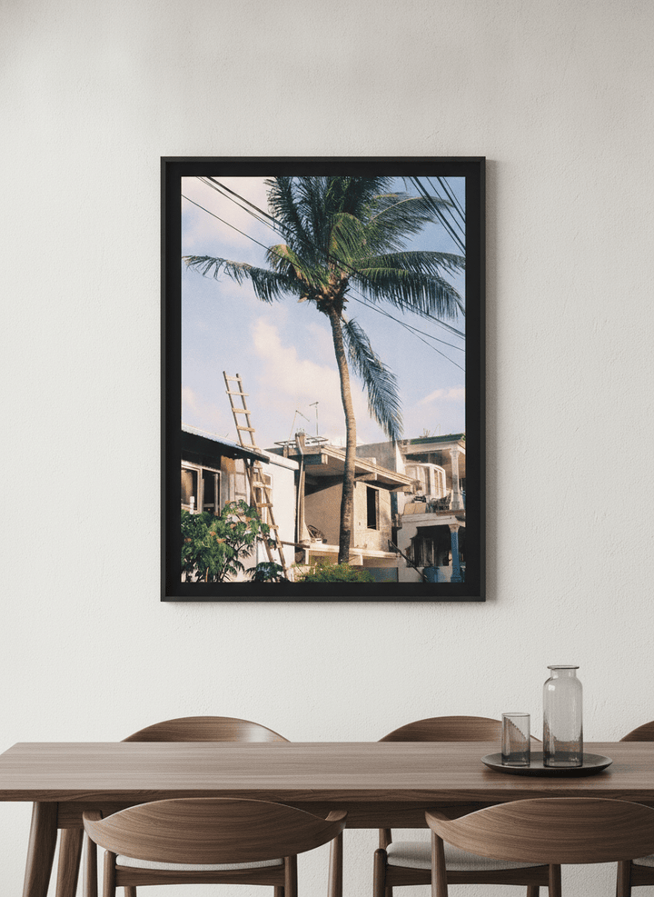 Wall art styled above a dining table in a contemporary home