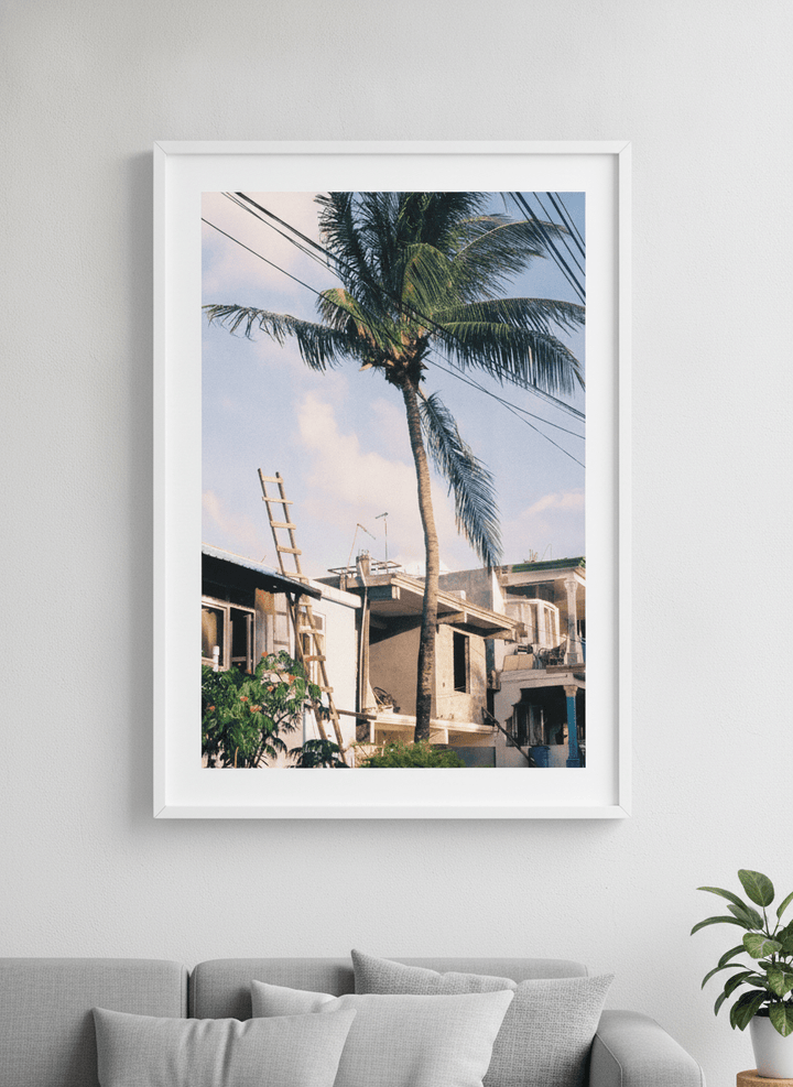 Modern wall art styled above a sofa in a neutral living room