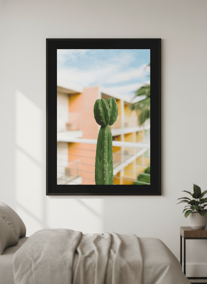 Minimalist artwork displayed in a calm, light-filled bedroom interior