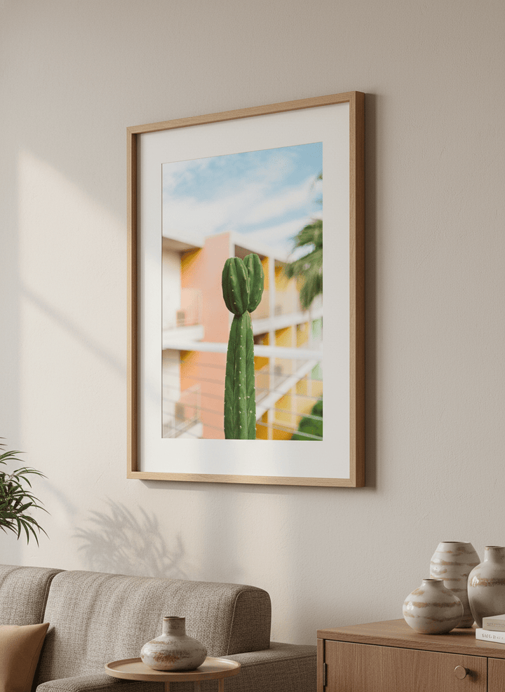 Modern wall art styled above a sofa in a neutral living room