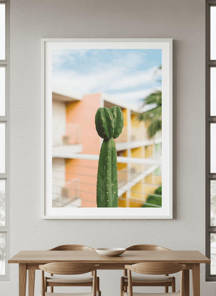 Wall art styled above a dining table in a contemporary home