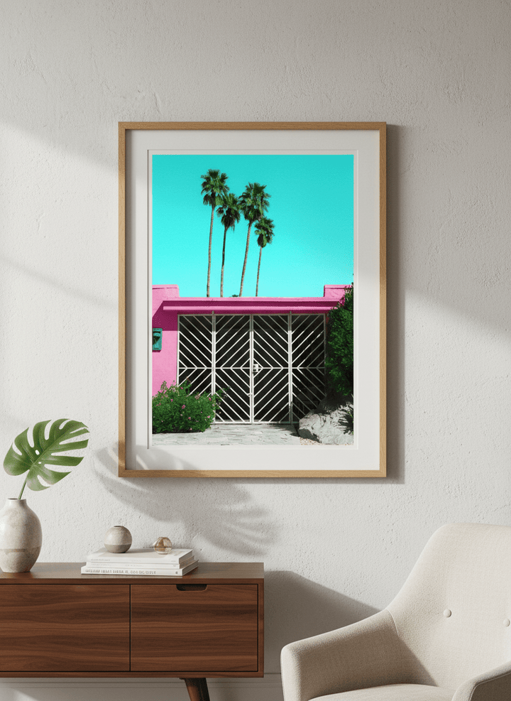 Modern wall art styled above a sofa in a neutral living room