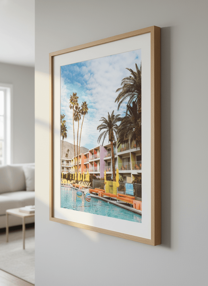 Modern wall art styled above a sofa in a neutral living room