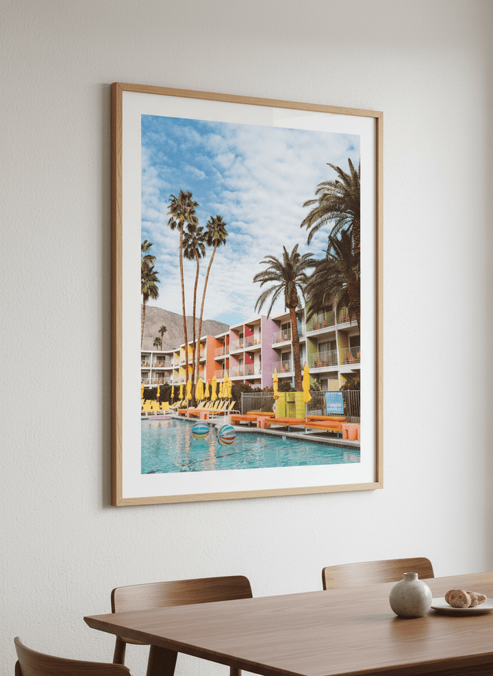 Wall art styled above a dining table in a contemporary home