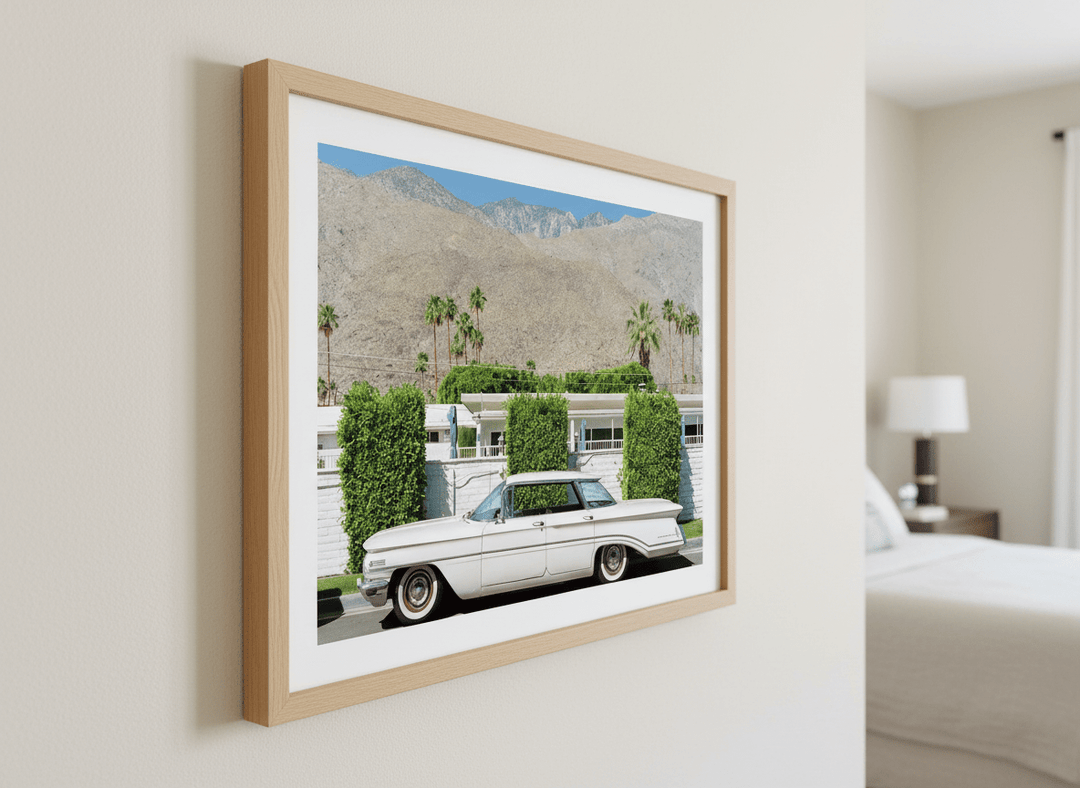 Minimalist artwork displayed in a calm, light-filled bedroom interior