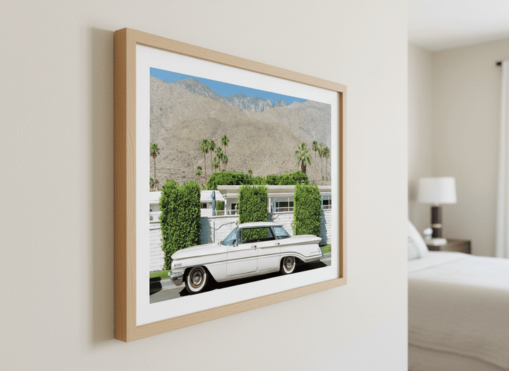 Minimalist artwork displayed in a calm, light-filled bedroom interior