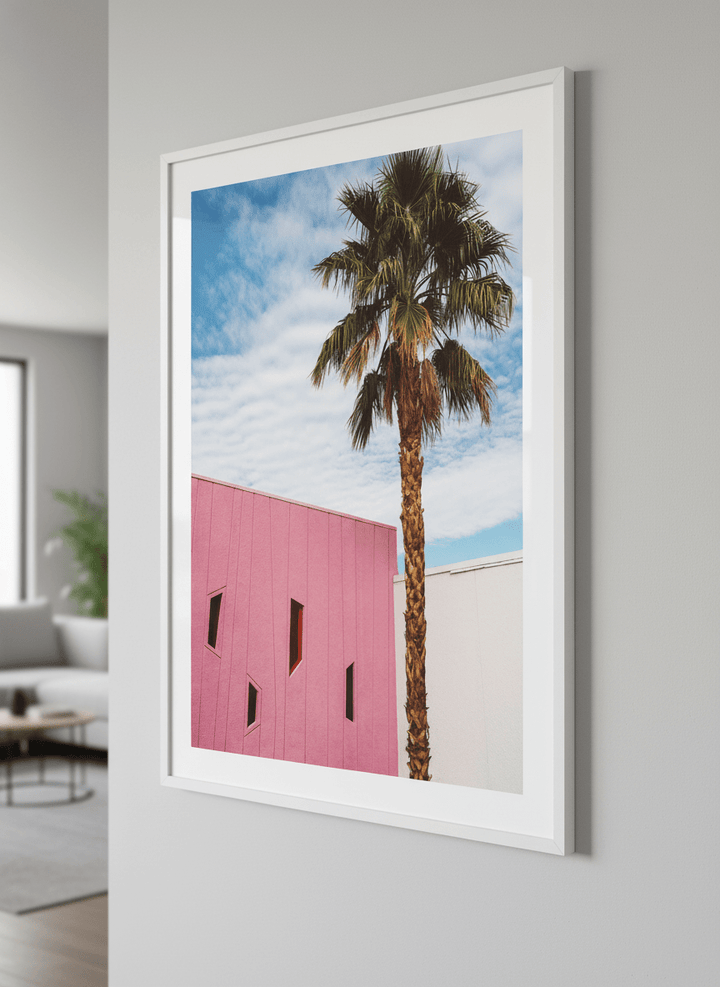 Modern wall art styled above a sofa in a neutral living room
