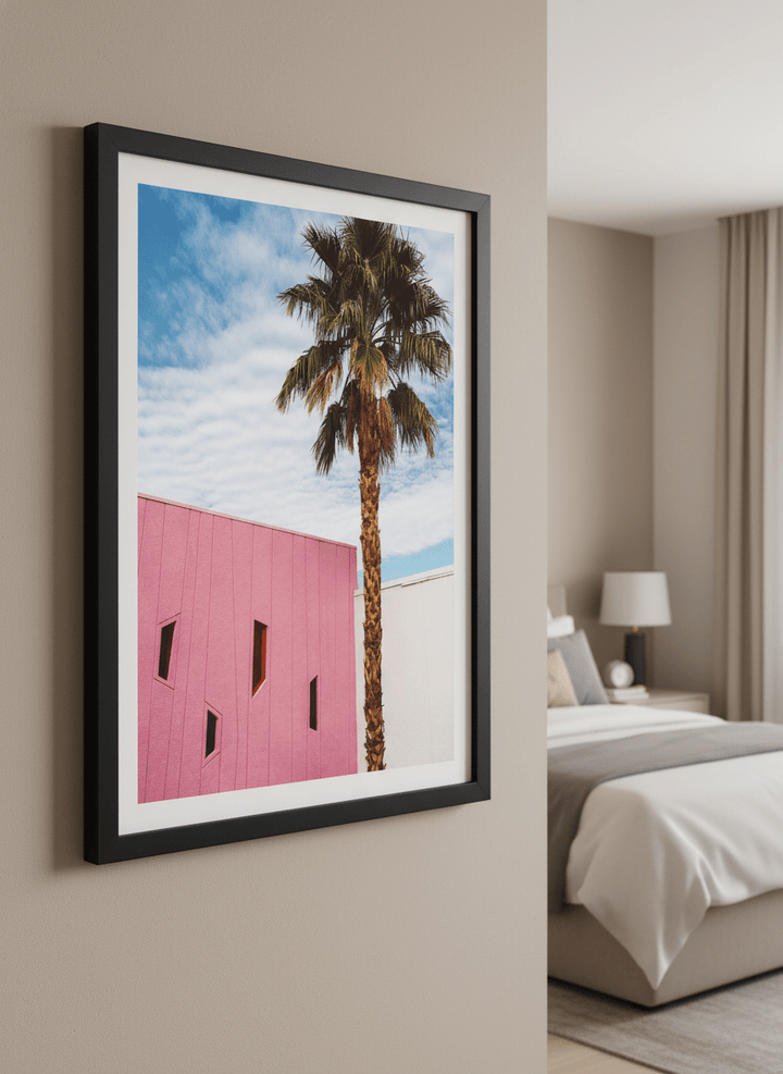 Minimalist artwork displayed in a calm, light-filled bedroom interior