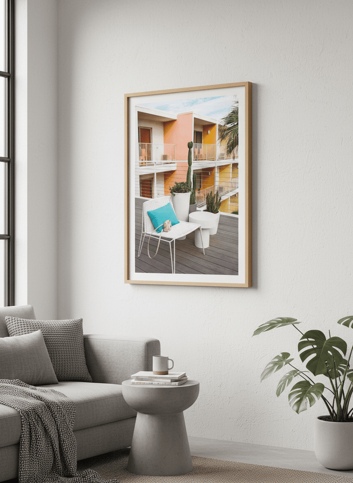 Modern wall art styled above a sofa in a neutral living room