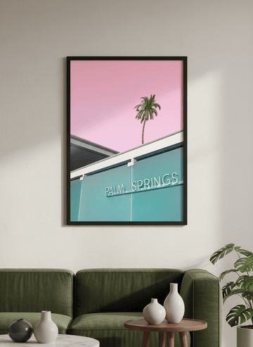 Modern wall art styled above a sofa in a neutral living room