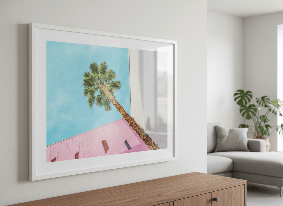 Modern wall art styled above a sofa in a neutral living room